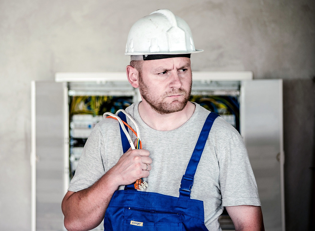 Licensed electrician performing professional electrical work on residential wiring in New Jersey